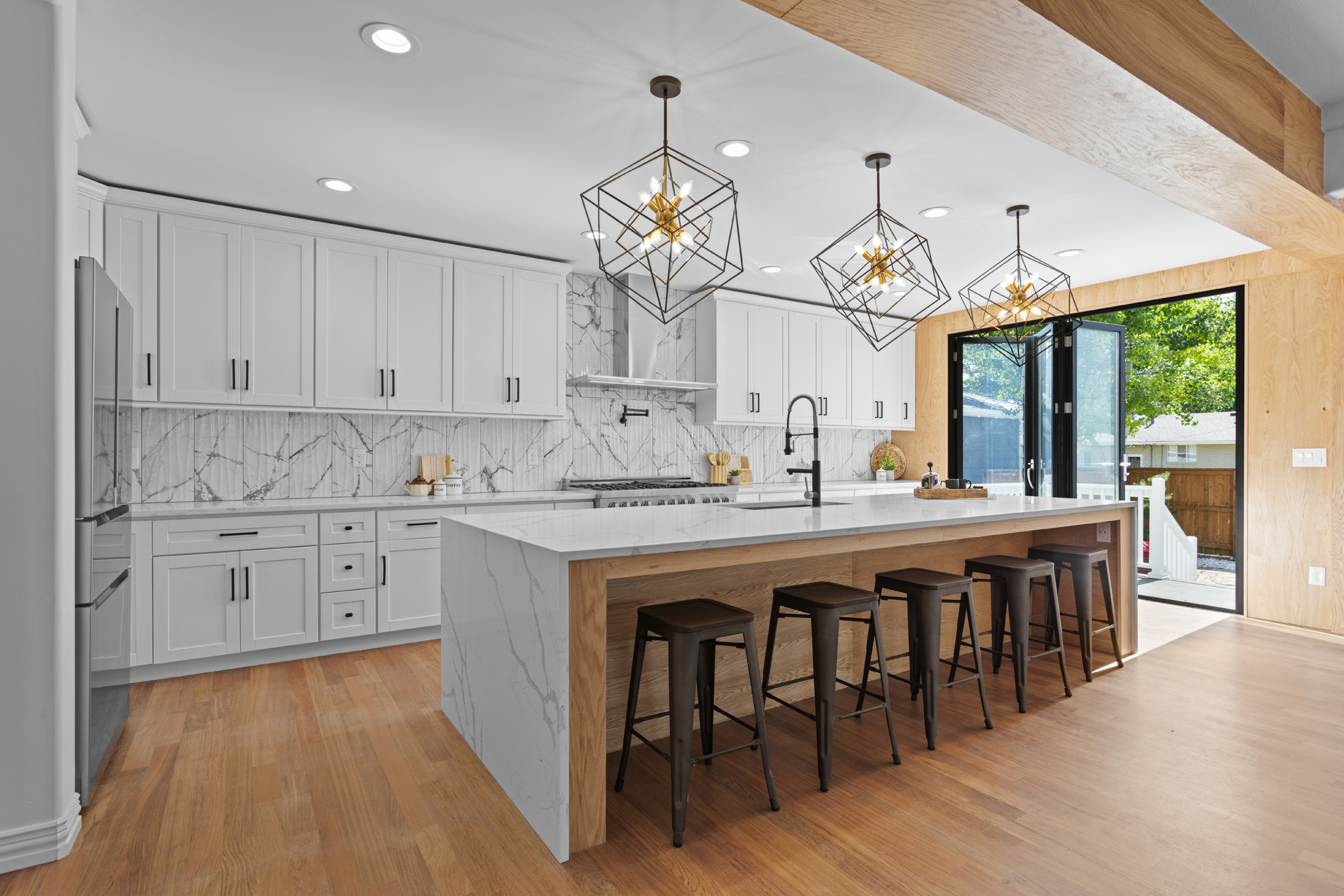 Custom built kitchen with dark wood floors white cabinets and photographed in aurora colorado